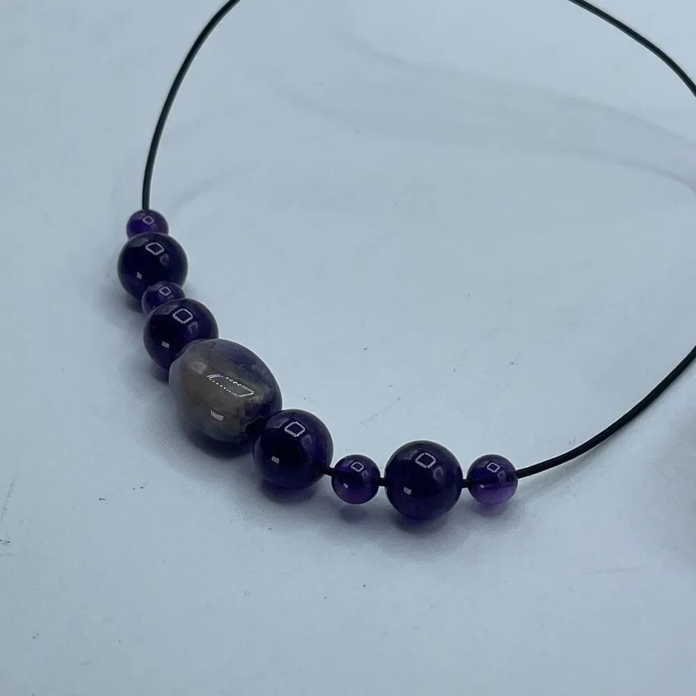 Amethyst cord beaded necklace 12” drop.